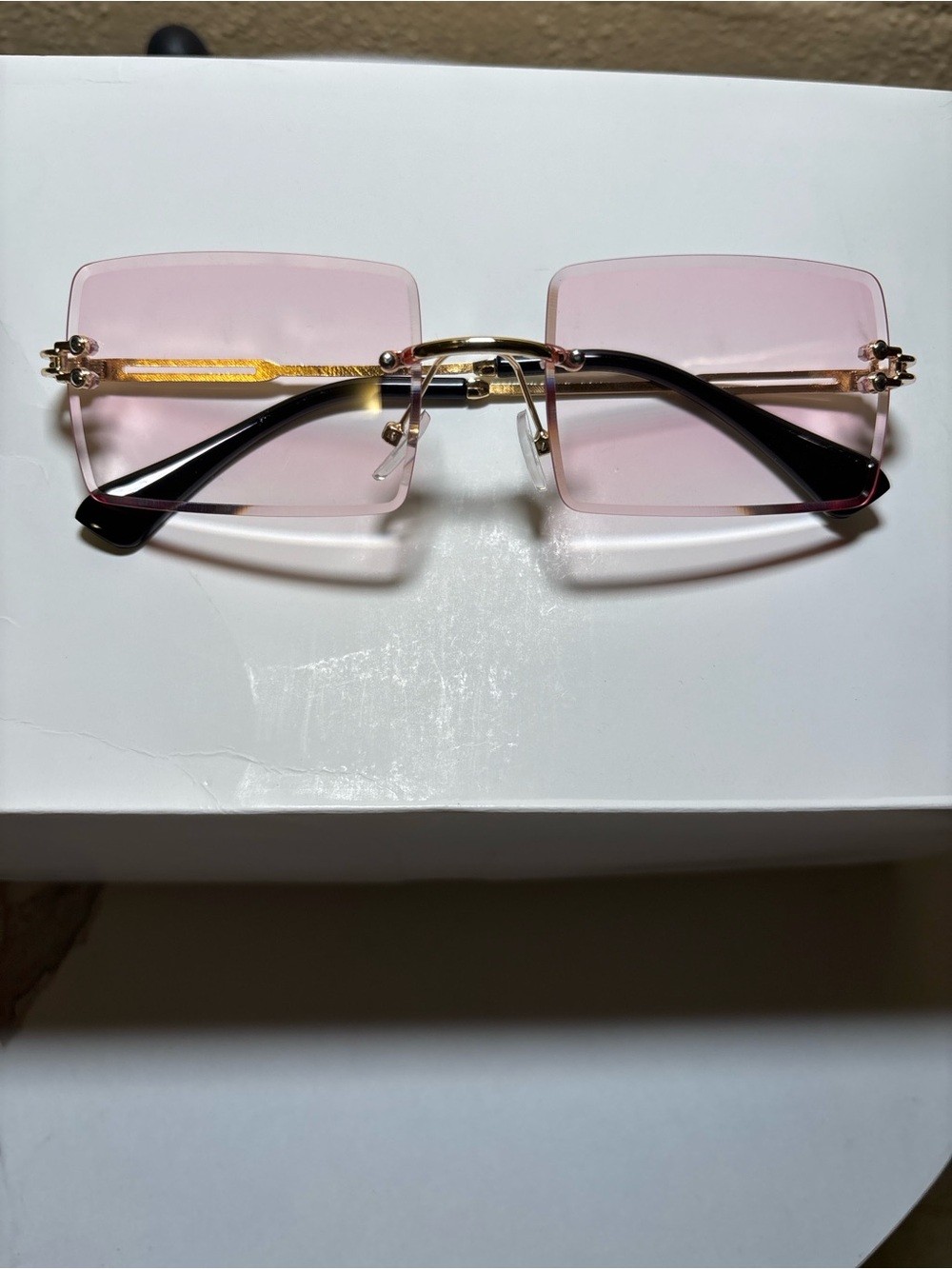 Women’s Rimless Pink Lens Sunglasses with Gold Trim